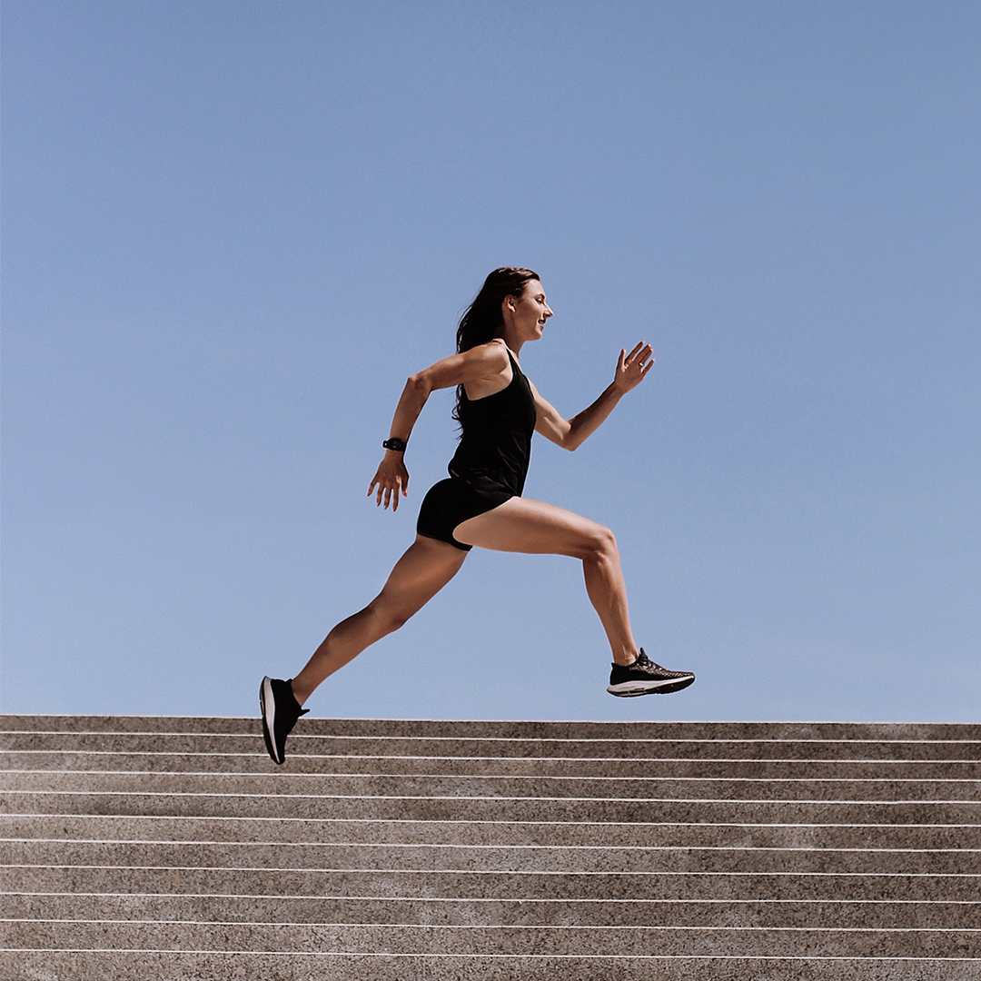 a woman running up stairs