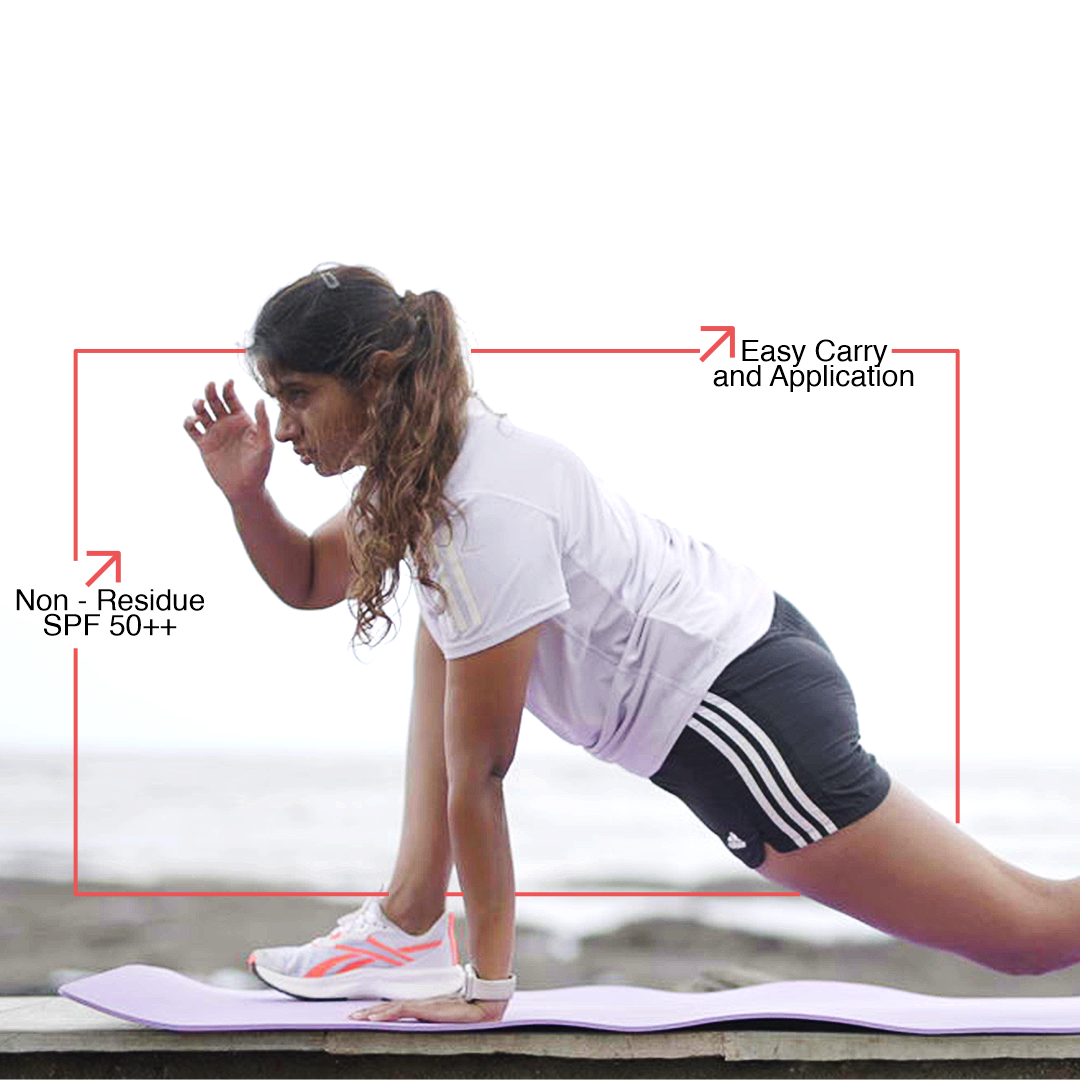 A woman performs a yoga on a mat