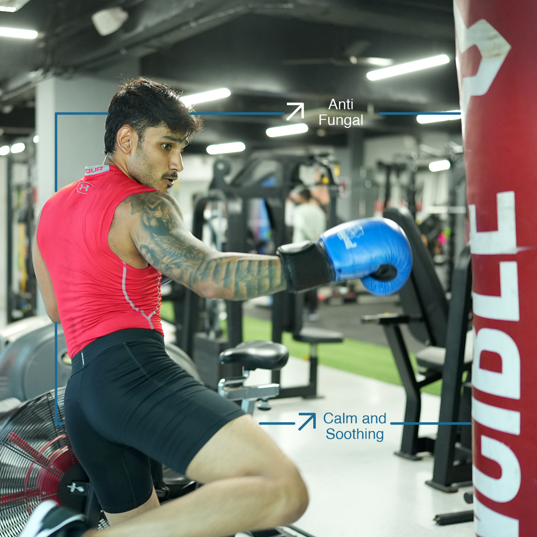 a man in a gym boxing gloves